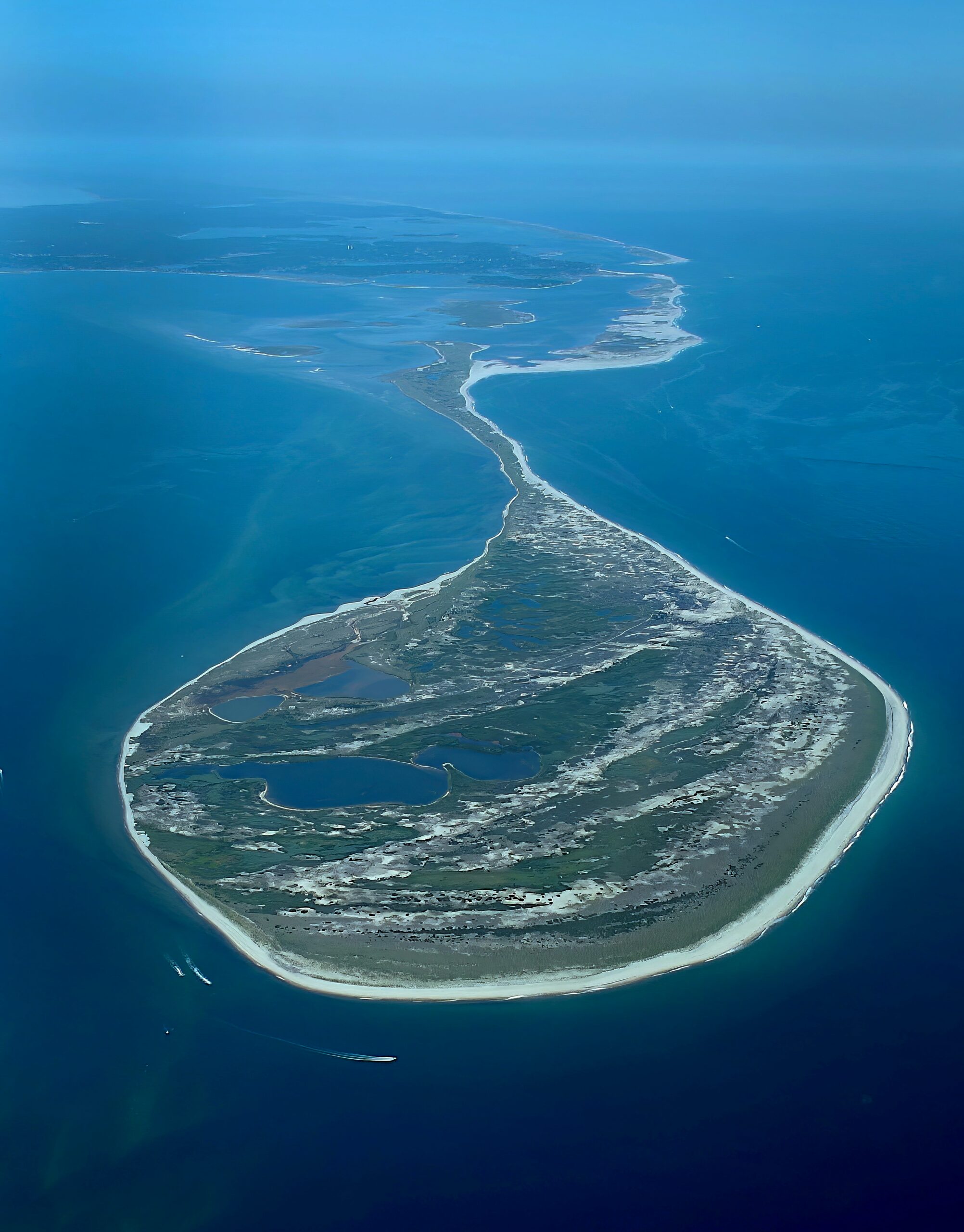 Island hopping boat at sunset with dockside view